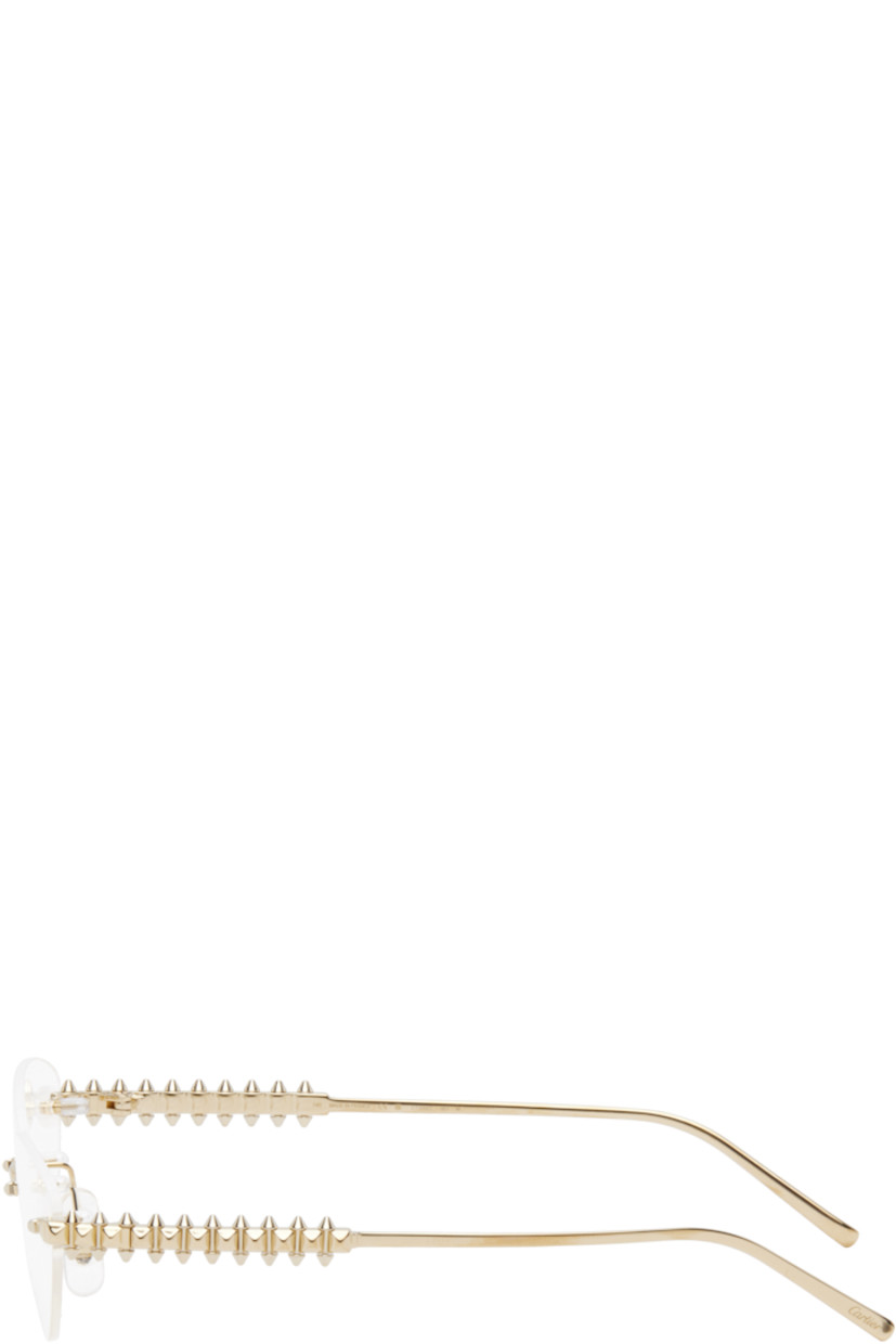 Cat-eye rimless metal-frame optical glasses in gold tone. 

· Adjustable rubber nose pads
· Stud hardware at temples
· Logo etched at temple tips
· Includes case
· Size: 57.16 140

Part of the Clash de Cartier collection.

Supplier color: Gold