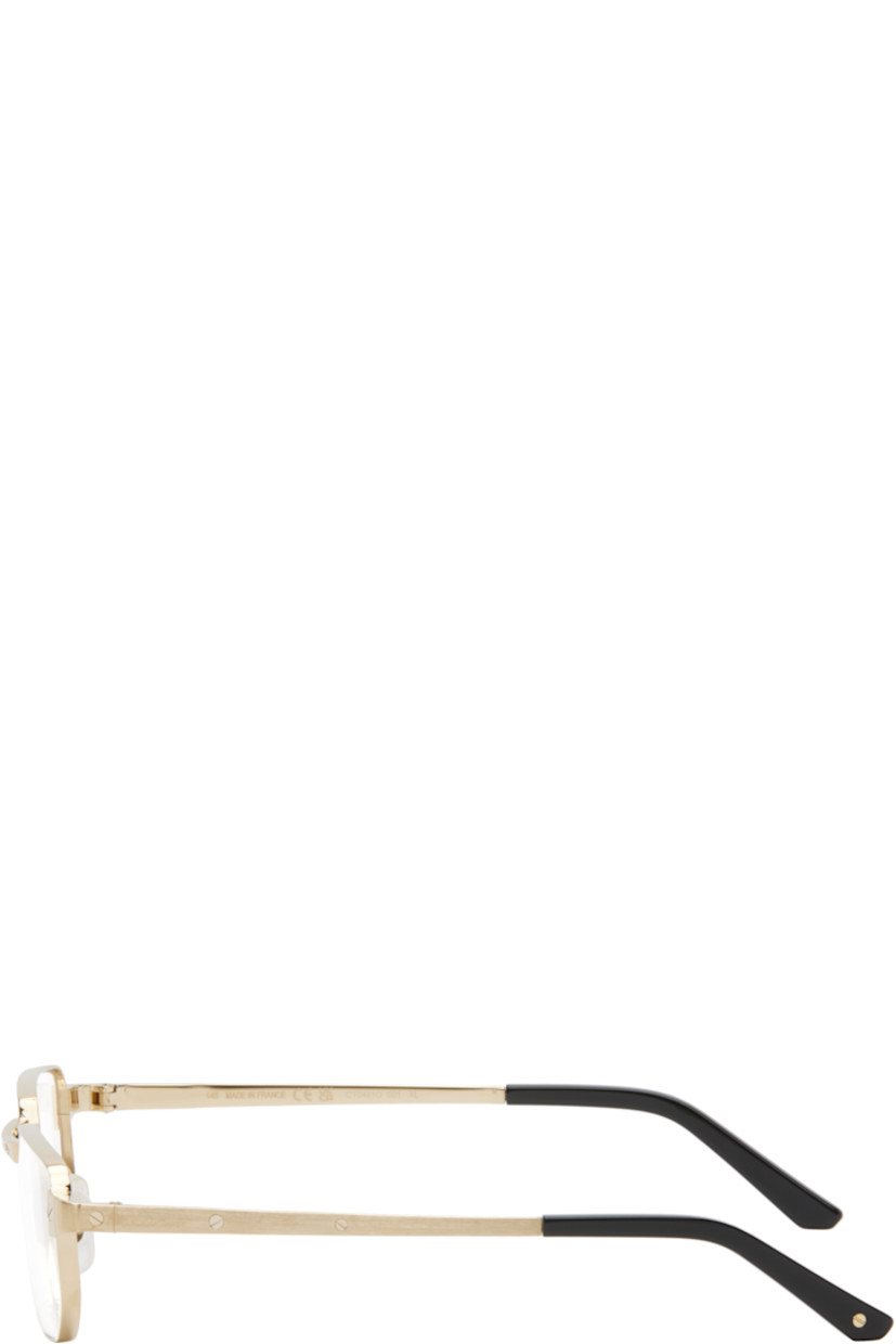 Rectangular metal-frame optical glasses in gold tone. 

· Exposed screws at face and temples
· Adjustable rubber nose pads
· Logo etched at temples
· Acetate temple tips in black
· Includes case
· Size: 53.19 145

Part of the Santos de Cartier collection.

Supplier color: Gold