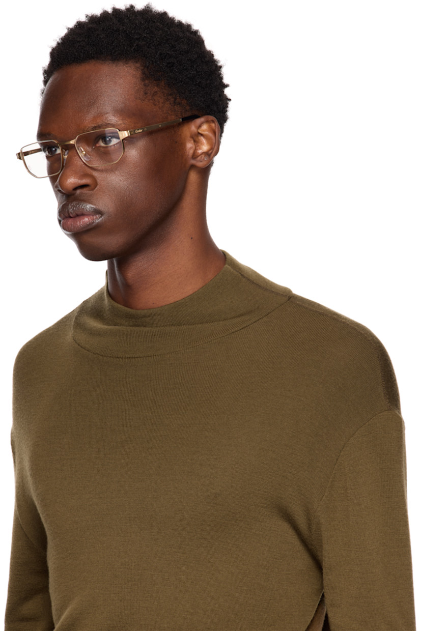Rectangular metal-frame optical glasses in gold tone. 

· Exposed screws at face and temples
· Adjustable rubber nose pads
· Logo etched at temples
· Acetate temple tips in black
· Includes case
· Size: 53.19 145

Part of the Santos de Cartier collection.

Supplier color: Gold