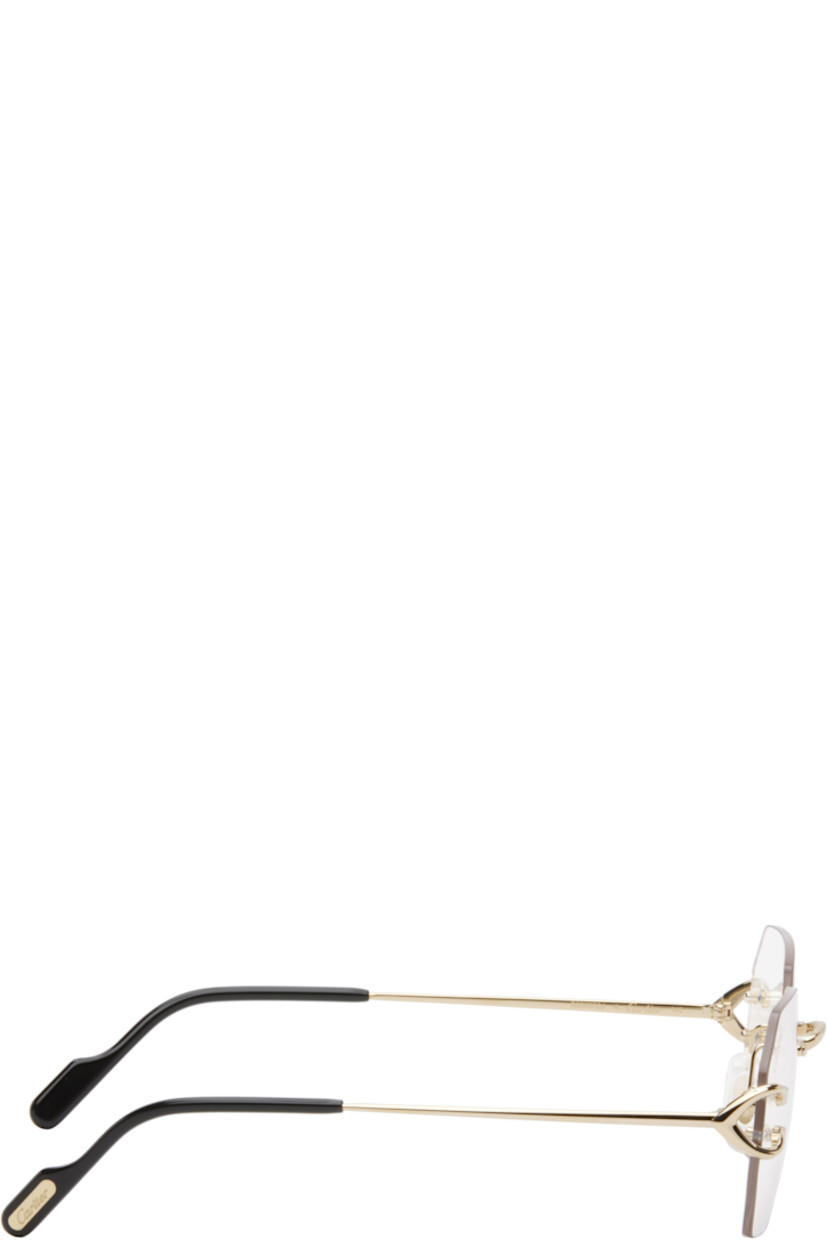 Hexagonal rimless metal-frame optical glasses in gold tone. 

· Adjustable rubber nose pads
· Logo hardware at hinges and tips
· Acetate temple tips in black
· Includes case
· Size: 55.18 140

Part of the Signature C de Cartier collection.

Supplier color: Gold