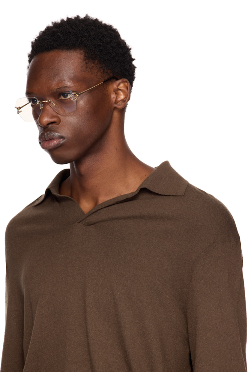 Hexagonal rimless metal-frame optical glasses in gold tone. 

· Adjustable rubber nose pads
· Logo hardware at hinges and tips
· Acetate temple tips in black
· Includes case
· Size: 55.18 140

Part of the Signature C de Cartier collection.

Supplier color: Gold