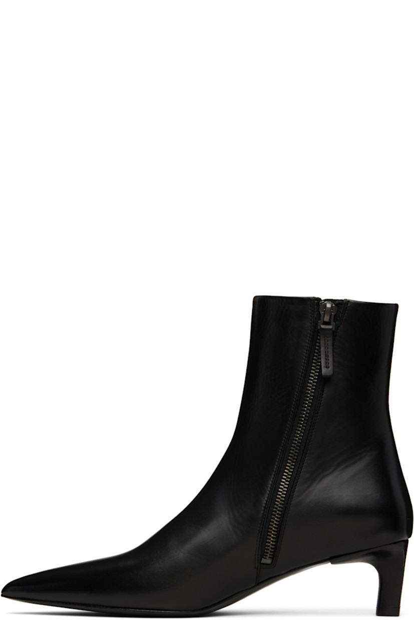 Ankle-high buffed leather boots in black.

· Pointed toe
· Zip closure at inner side
· Stacked leather heel with rubber injection
· Leather sole
· Heel: H2"

Supplier color: Black