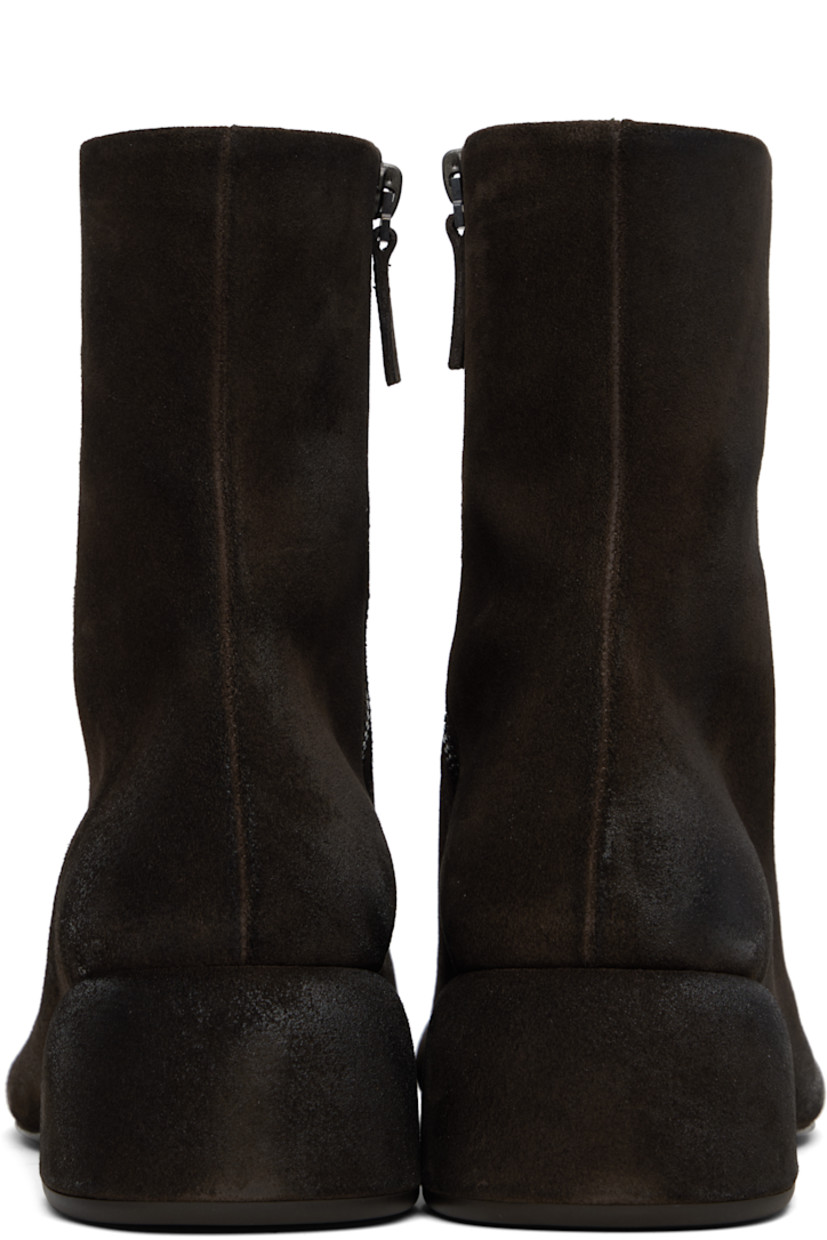 Ankle-high calfskin suede boots. Subtle distressing throughout. 

· Zip closure at inner side
· Grained leather lining
· Suede-covered block heel
· Rubber sole
· Heel: H2.25"

Supplier color: Dark brown