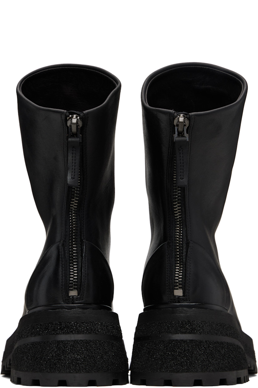 Ankle-high nubuck boots. 

· Zip closure at back
· Buffed leather lining
· Topstitching at welt
· Stacked foam rubber platform midsole
· Treaded rubber sole
· Heel: H2.25"

Supplier color: Black