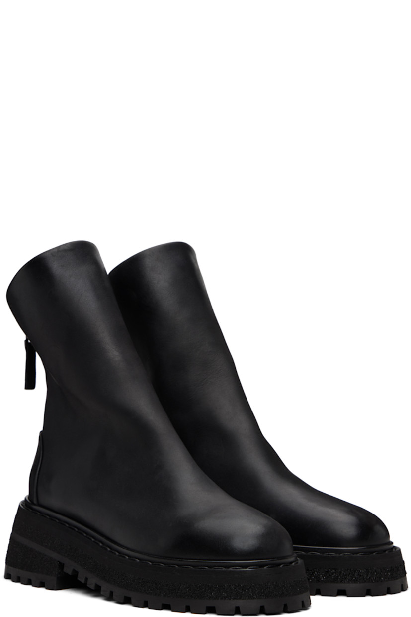 Ankle-high nubuck boots. 

· Zip closure at back
· Buffed leather lining
· Topstitching at welt
· Stacked foam rubber platform midsole
· Treaded rubber sole
· Heel: H2.25"

Supplier color: Black