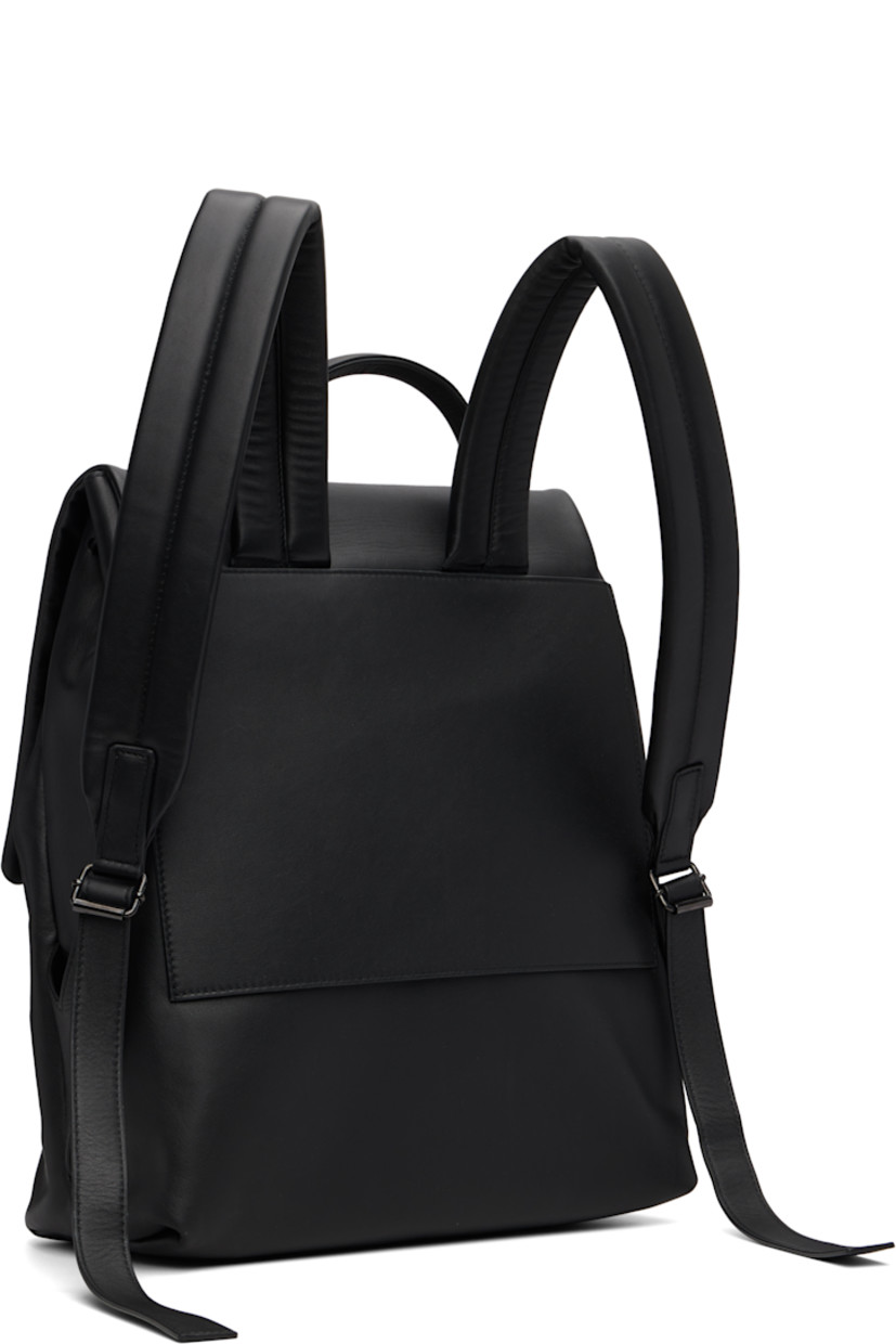 Buffed leather backpack.

· Rolled carry handle
· Padded adjustable shoulder straps
· Logo-embossed magnetic flap 
· Drawstring at throat
· Zip pocket at interior 
· H14.5"  W12.5" x D6"

Supplier color: Black