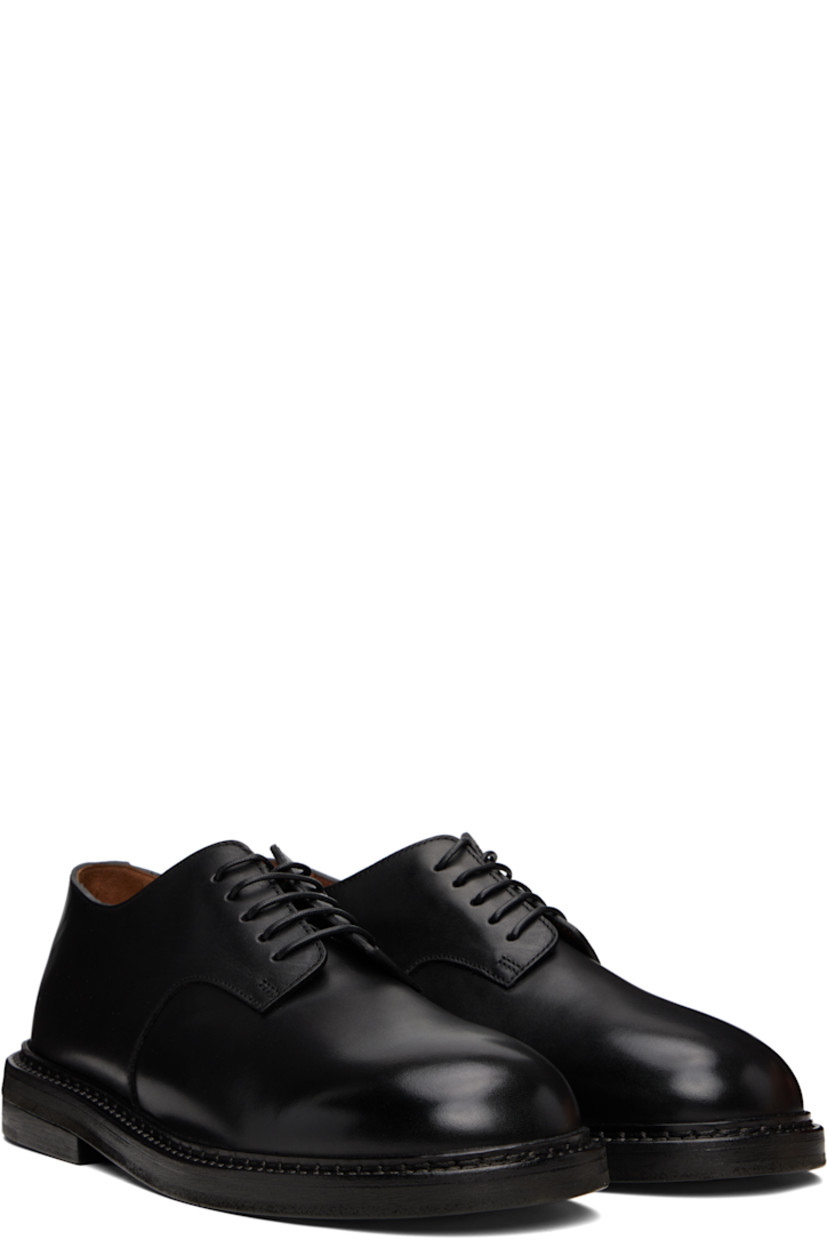 Buffed leather derbys in black.

· Lace-up closure
· Topstitching at welt
· Stacked leather heel with rubber injection 
· Leather sole

Supplier color: Black