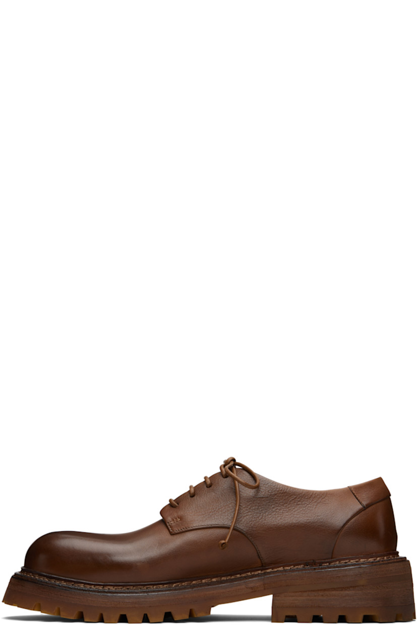 Grained leather derbys.

· Lace-up closure
· Buffed leather lining
· Topstitching at welt
· Stacked leather and rubber heel and midsole
· Treaded rubber sole

Supplier color: Basalt