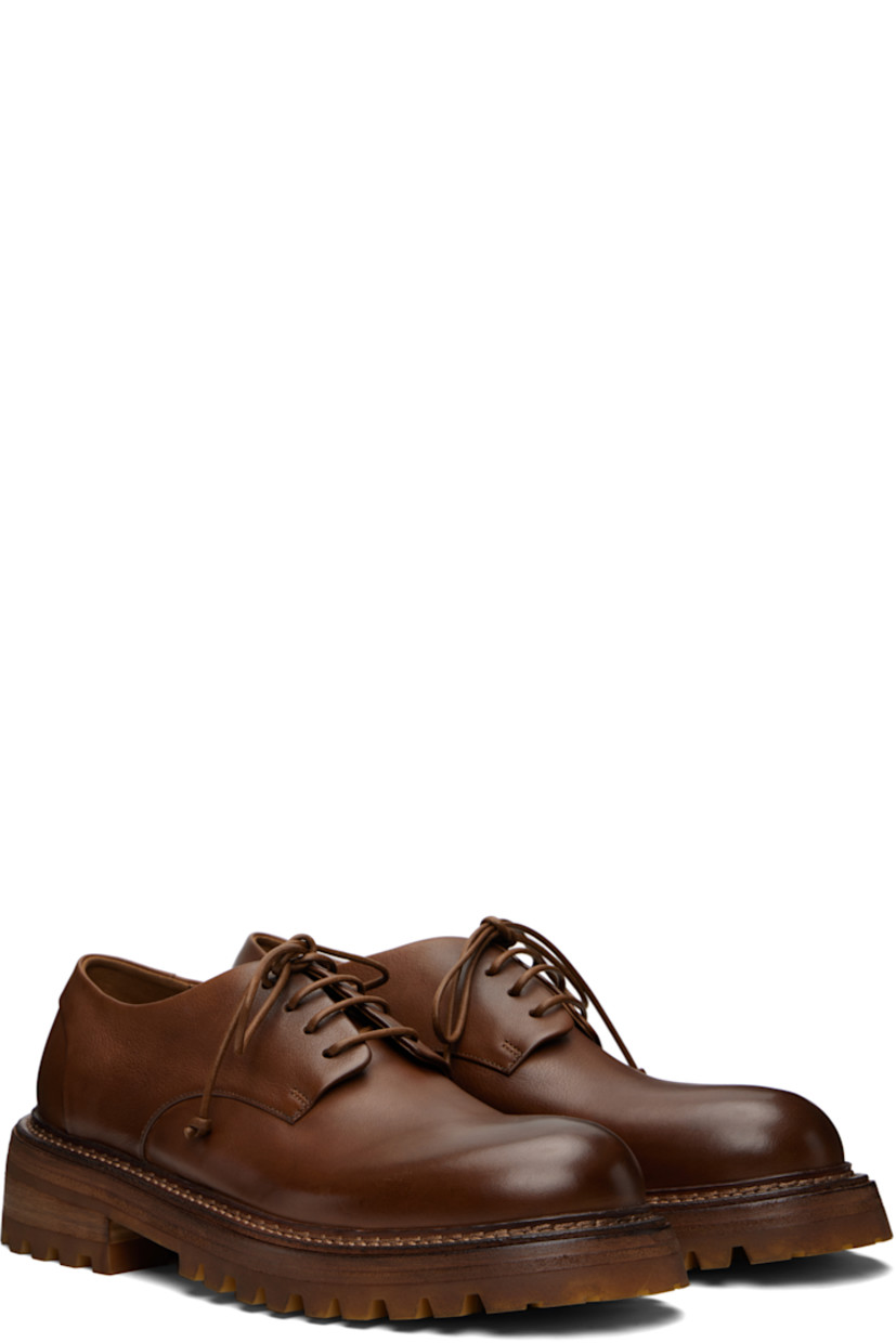 Grained leather derbys.

· Lace-up closure
· Buffed leather lining
· Topstitching at welt
· Stacked leather and rubber heel and midsole
· Treaded rubber sole

Supplier color: Basalt
