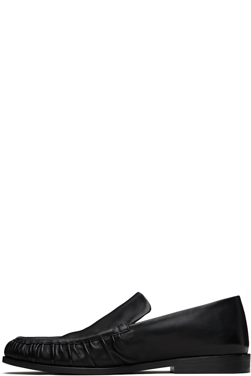 Buffed leather loafers.

· Gathering at moc toe
· Stacked leather heel with rubber injection
· Leather sole

Supplier color: Black