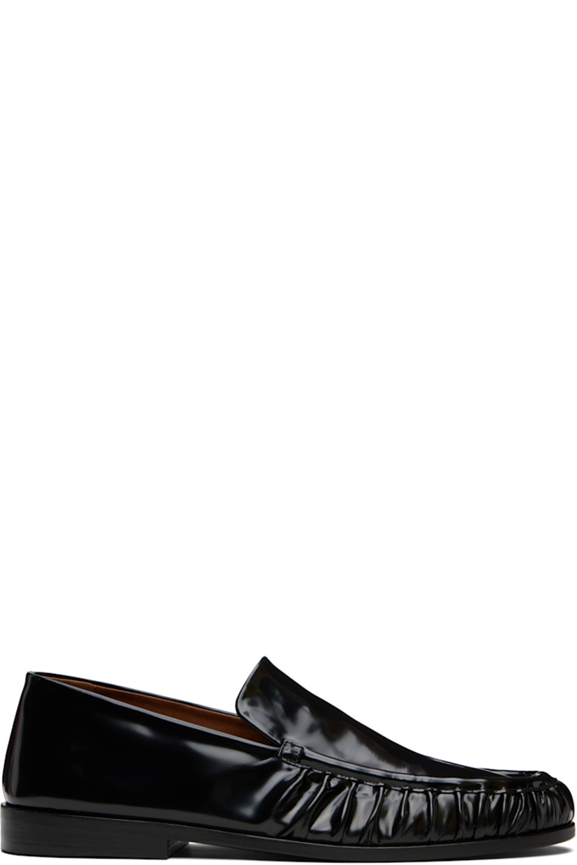 Patent leather loafers.

· Gathering at moc toe
· Buffed leather lining
· Stacked leather heel with rubber injection
· Leather sole

Supplier color: Black