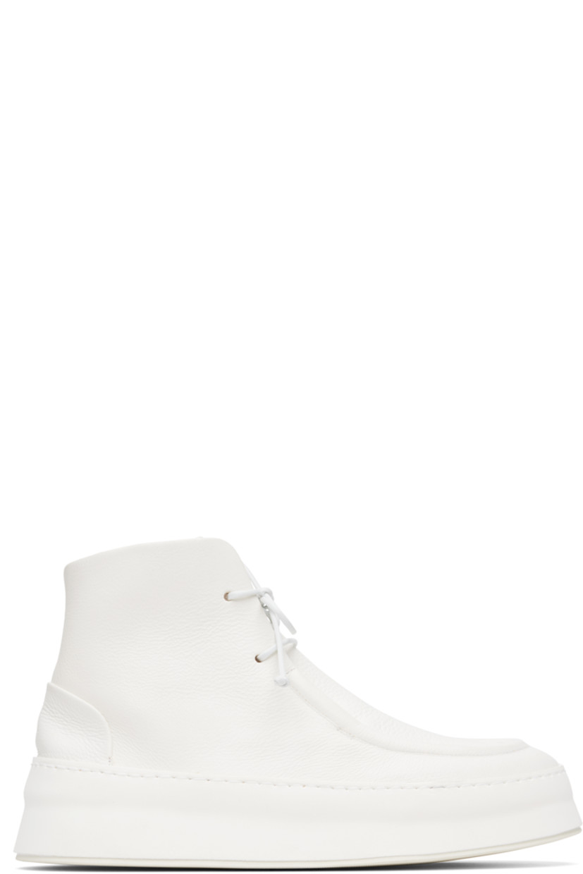 Ankle-high grained leather boots.

· Moc toe
· Lace-up closure
· Buffed leather lining
· Foam rubber platform midsole
· Treaded rubber sole
· Platform: H1.5"

Supplier color: Optical white