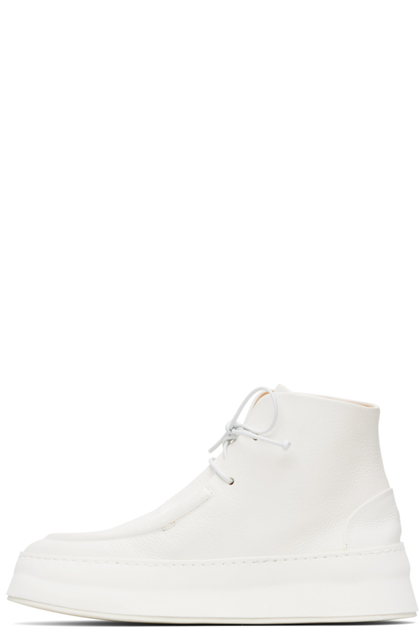Ankle-high grained leather boots.

· Moc toe
· Lace-up closure
· Buffed leather lining
· Foam rubber platform midsole
· Treaded rubber sole
· Platform: H1.5"

Supplier color: Optical white