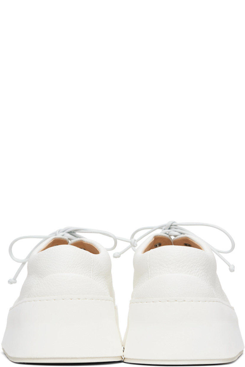 Grained leather derbys.

· Moc toe
· Lace-up closure
· Padded tongue and collar
· Buffed leather lining
· Foam rubber platform midsole
· Treaded rubber sole
· Platform: H1.5"

Supplier color: Optical white