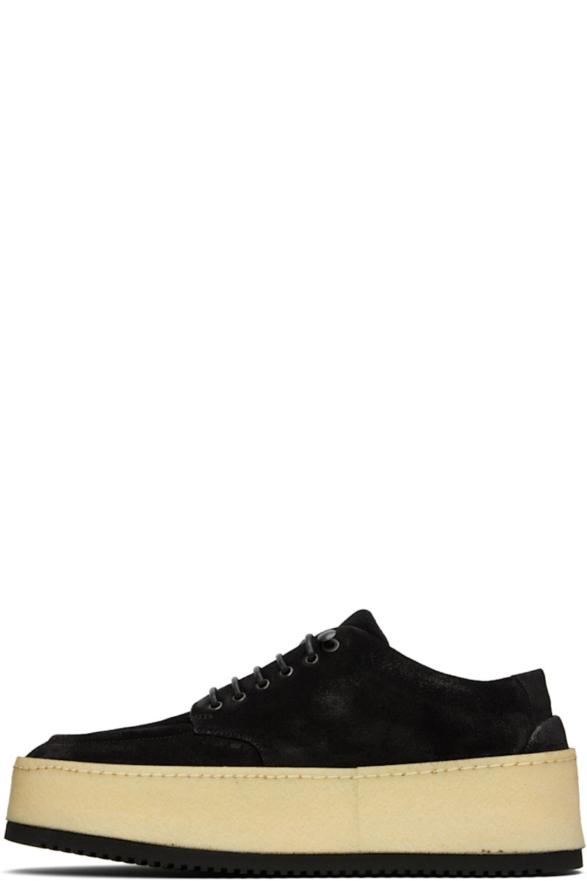 Suede derbys in black.

· Moc toe
· Lace-up closure
· Buffed leather lining
· Crêpe rubber platform midsole
· Treaded foam rubber sole
· Platform: H1.5"

Supplier color: Black
