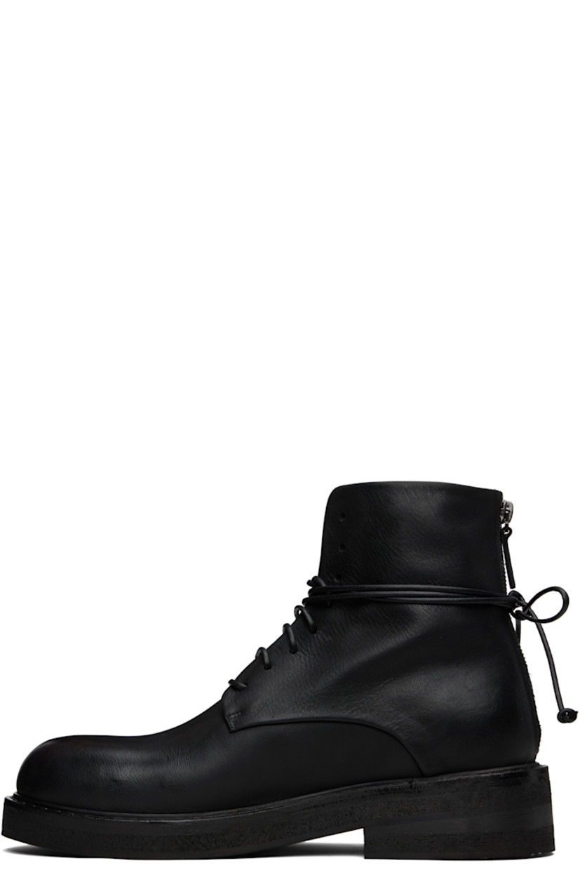 Ankle-high buffed leather boots.

· Lace-up closure
· Zip closure at heel
· Topstitching at welt
· Stacked leather and foam rubber midsole
· Treaded rubber sole
· Heel: H1.75"

Supplier color: Black