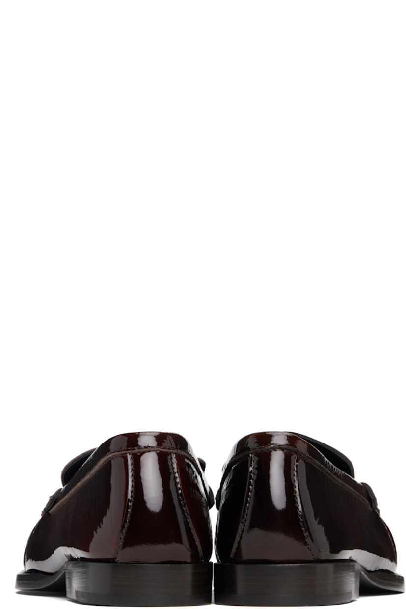 Patent leather loafers.

· Moc toe
· Buffed leather lining
· Stacked leather heel with rubber injection
· Leather sole

Supplier color: Brown