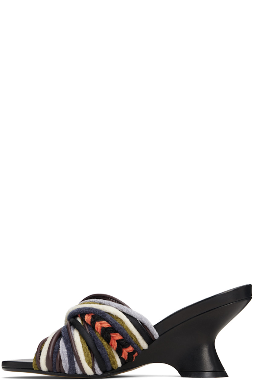 Velvet and buffed leather slip-on heeled sandals.

· Open toe
· Twisted straps at vamp
· Logo stamp at padded footbed
· Covered wedge heel with rubber injection
· Leather sole
· Heel: H3"

Supplier color: Multi