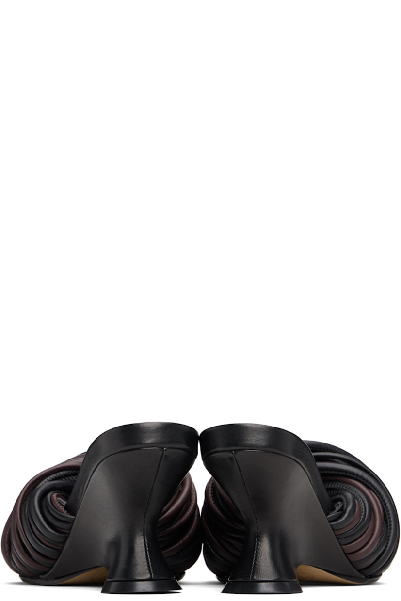 Buffed leather slip-on heeled sandals.

· Open toe
· Twisted straps at vamp
· Logo stamp at padded footbed
· Covered wedge heel with rubber injection
· Leather sole
· Heel: H3"

Supplier color: Dark brown