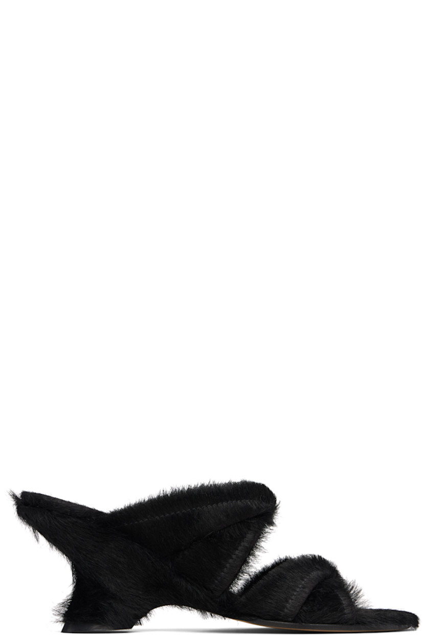 Hair-on leather heeled sandals.

· Open toe
· Twisted straps at vamp
· Logo stamp at padded footbed
· Covered wedge heel with rubber injection
· Leather sole
· Heel: H2.75"

Supplier color: Black