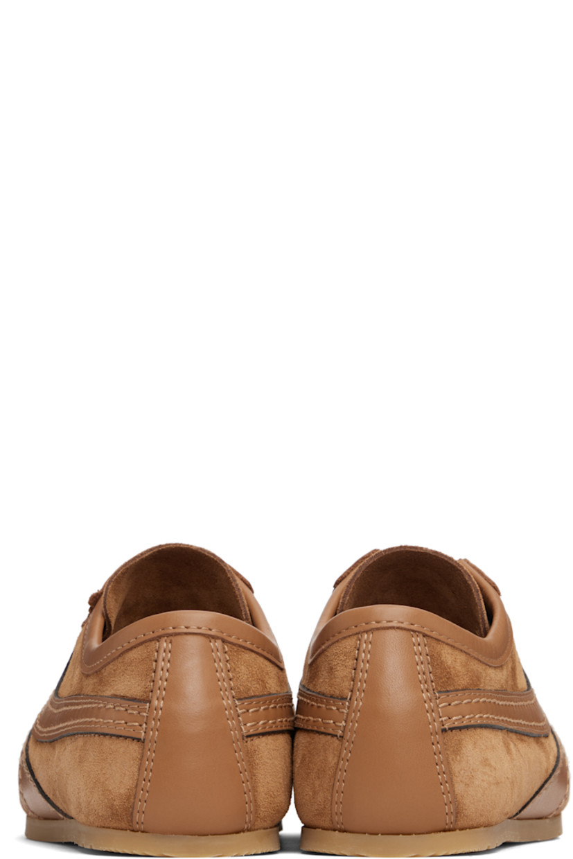 Low-top calfskin suede and buffed calfskin sneakers.

· Serrated edge at vamp
· Lace-up closure
· Logo printed at tongue
· Treaded rubber sole

Supplier color: Tan