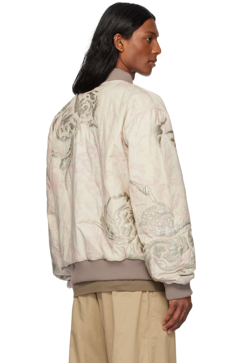 Reversible cotton poplin bomber jacket. Floral pattern printed and embroidered throughout.

Reverse in silver tone plain-woven viscose-blend. Metallic threads throughout.

· Rib-knit stand collar, hem, and cuffs
· Two-way zip closure
· Zip pockets
· Welt pockets at interior

Supplier color: Light pink