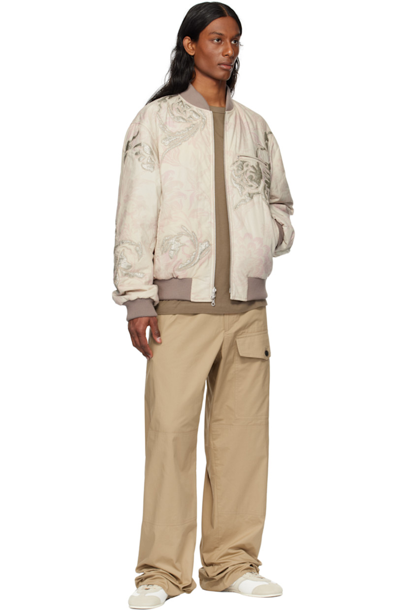 Reversible cotton poplin bomber jacket. Floral pattern printed and embroidered throughout.

Reverse in silver tone plain-woven viscose-blend. Metallic threads throughout.

· Rib-knit stand collar, hem, and cuffs
· Two-way zip closure
· Zip pockets
· Welt pockets at interior

Supplier color: Light pink