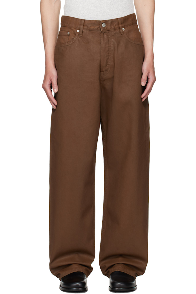 Coated heavyweight non-stretch denim jeans.

· Loose-fit, straight-leg
· Mid-rise
· Belt loops
· Five-pocket styling
· Button fly
· Pinched leather logo patch at back waistband
· Logo-engraved silver-tone hardware

Supplier color: Rust