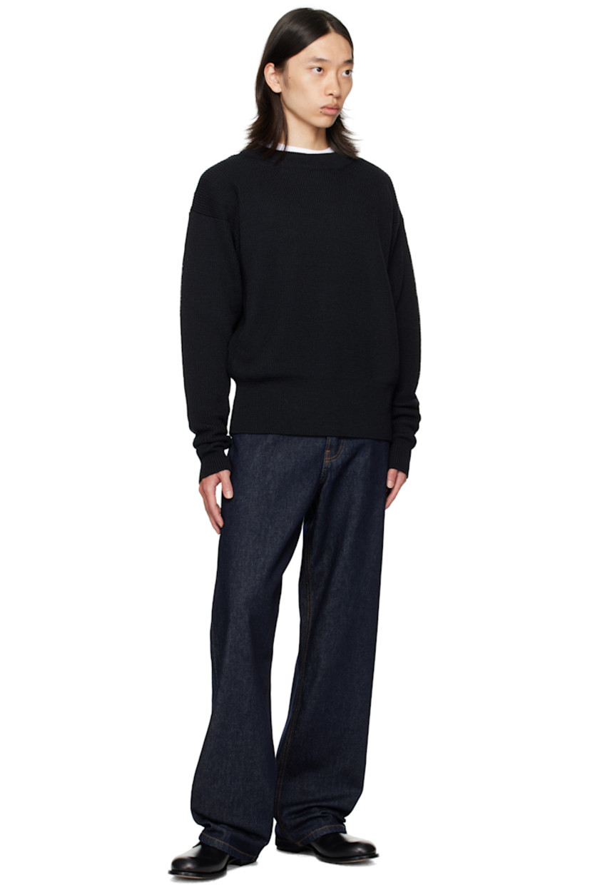 Non-stretch denim jeans.

· Loose-fit
· Belt loops
· Five-pocket styling
· Button fly
· Pinched leather logo patch at back waistband
· Logo-engraved silver-tone hardware
· Contrast stitching in tan

Supplier color: Indigo