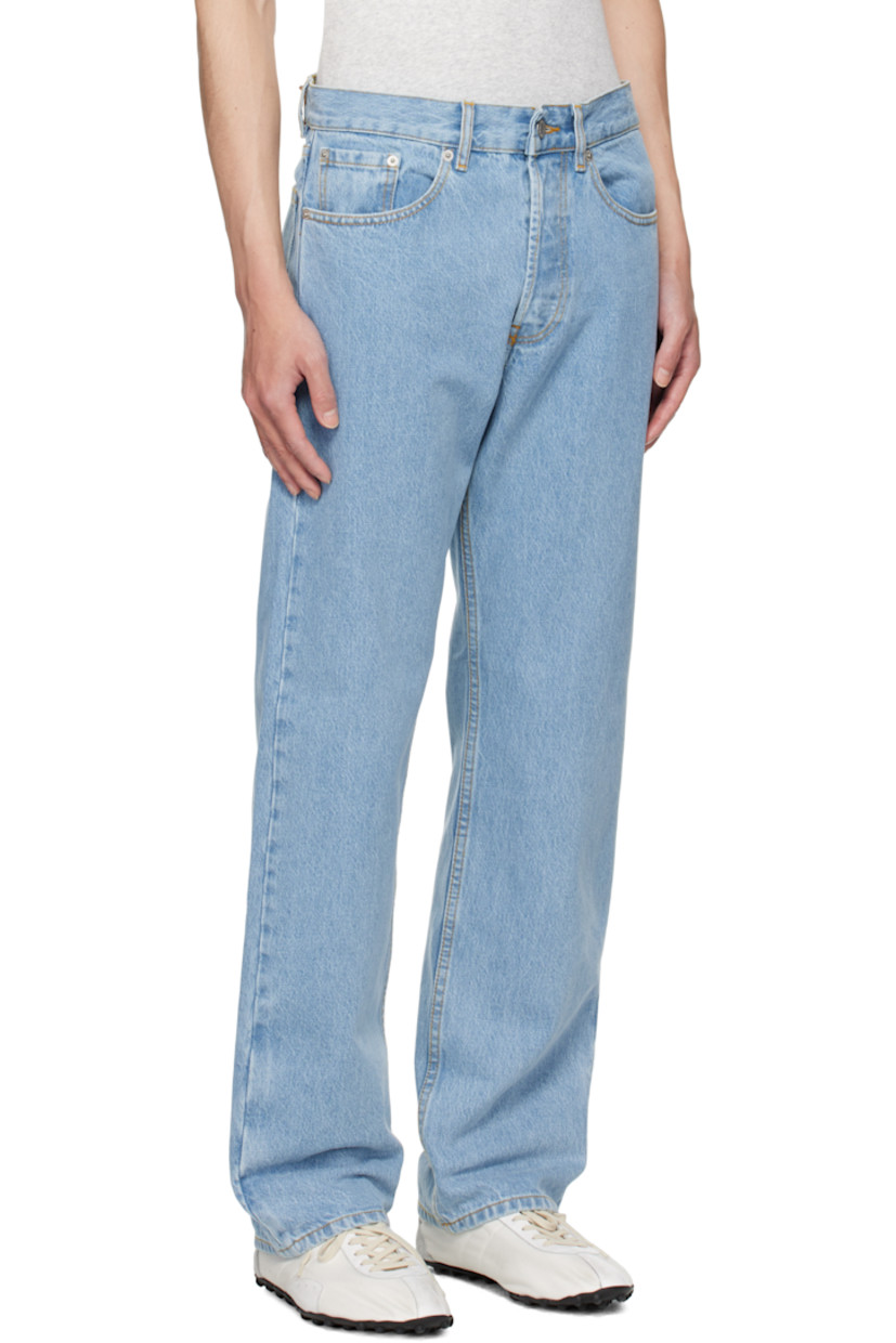 Non-stretch denim jeans.

· Fading throughout
· Belt loops
· Five-pocket styling
· Button fly
· Pinched leather logo patch at back waistband
· Logo-engraved silver-tone hardware
· Contrast stitching in tan

Supplier color: Light blue