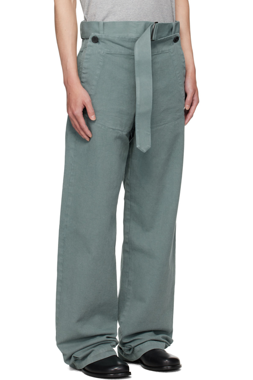 Overdyed cotton twill trousers.

· Belt loops
· Detachable cinch belt at waistband
· Four-pocket styling
· Zip fly
· Buttoned overlay at front

Supplier color: Raf