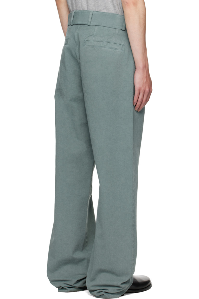 Overdyed cotton twill trousers.

· Belt loops
· Detachable cinch belt at waistband
· Four-pocket styling
· Zip fly
· Buttoned overlay at front

Supplier color: Raf