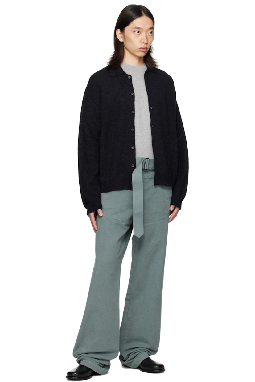 Overdyed cotton twill trousers.

· Belt loops
· Detachable cinch belt at waistband
· Four-pocket styling
· Zip fly
· Buttoned overlay at front

Supplier color: Raf