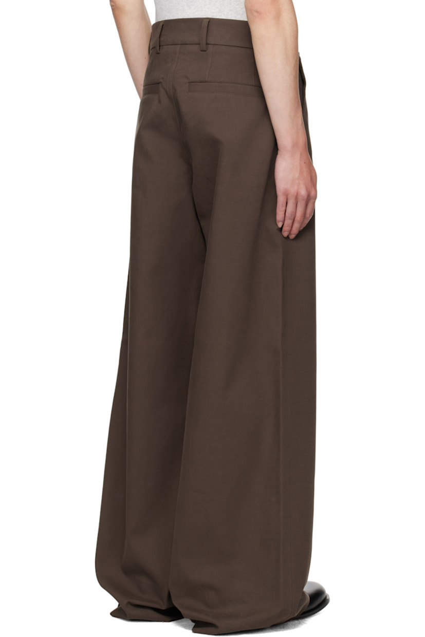 Plain-woven stretch cotton trousers.

· Belt loops
· Four-pocket styling
· Zip fly
· Buttoned overlay at front
· Concealed patch pockets

Supplier color: Mud
