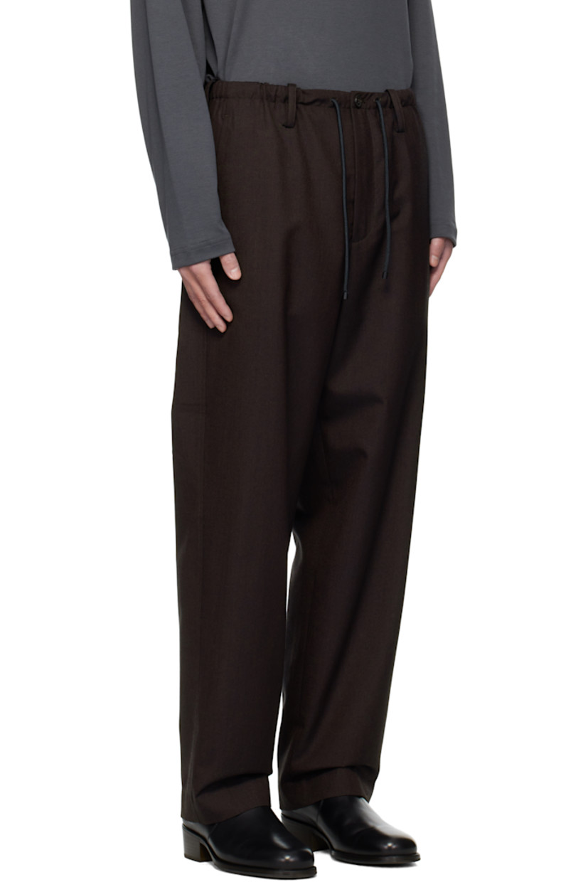 Wool canvas trousers.

· Drawstring and belt loops at elasticized waistband
· Three-pocket styling
· Zip fly

Supplier color: Dark brown