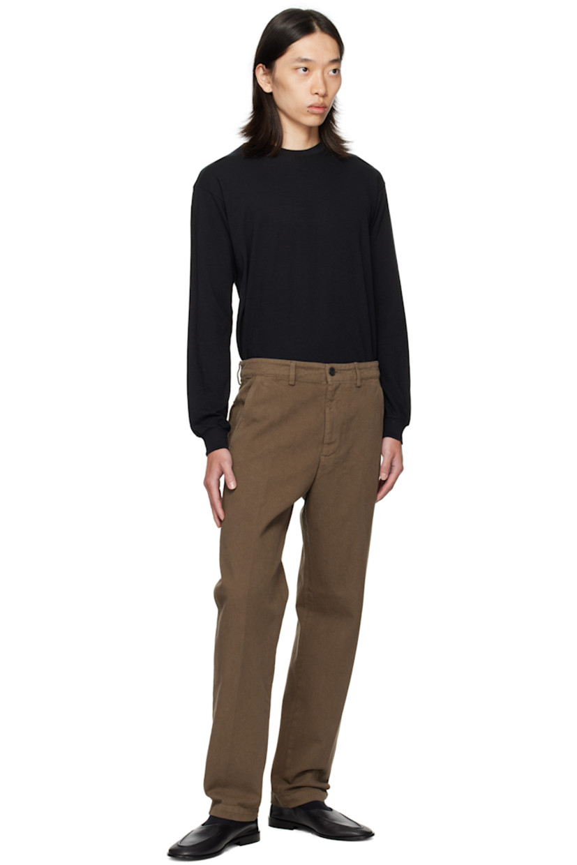Overdyed cotton twill trousers.

· Belt loops
· Four-pocket styling
· Zip fly

Supplier color: Mud
