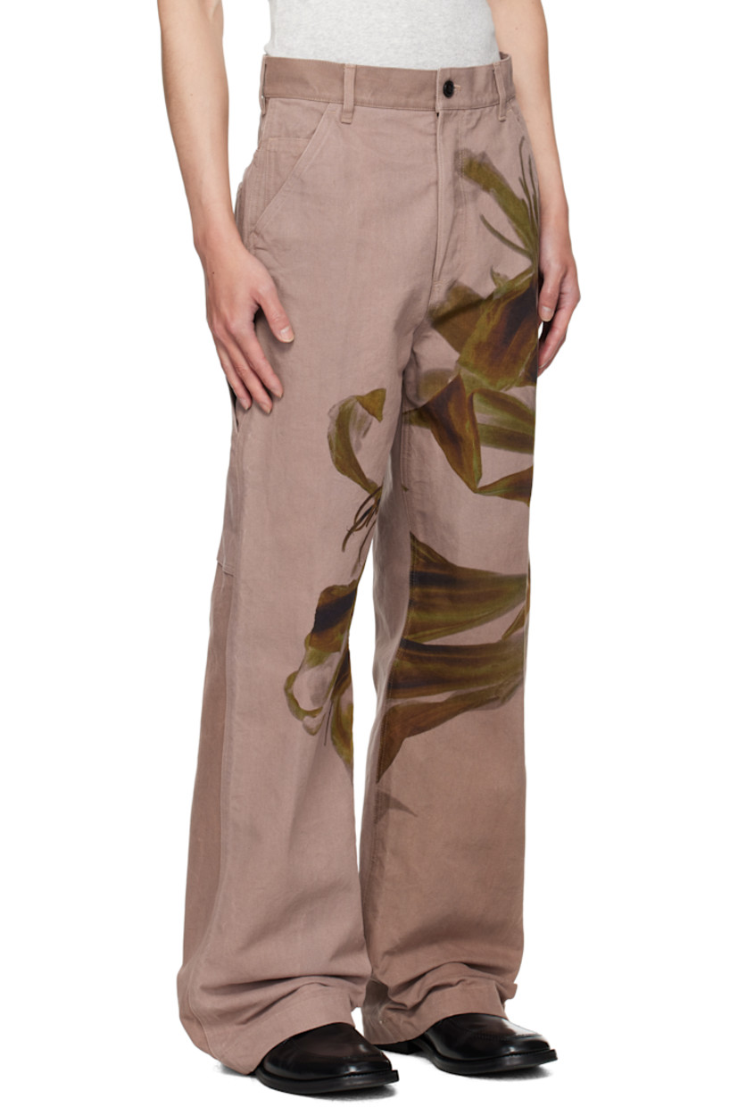 Cotton canvas trousers.

· Graphic printed throughout
· Belt loops
· Five-pocket styling
· Button fly
· Creased legs
· Patch pockets at back

Supplier color: Old rose