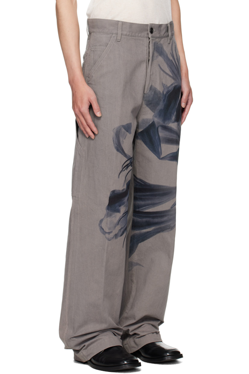 Cotton canvas trousers.

· Graphic printed throughout
· Belt loops
· Five-pocket styling
· Button fly
· Creased legs
· Patch pockets at back

Supplier color: Grey