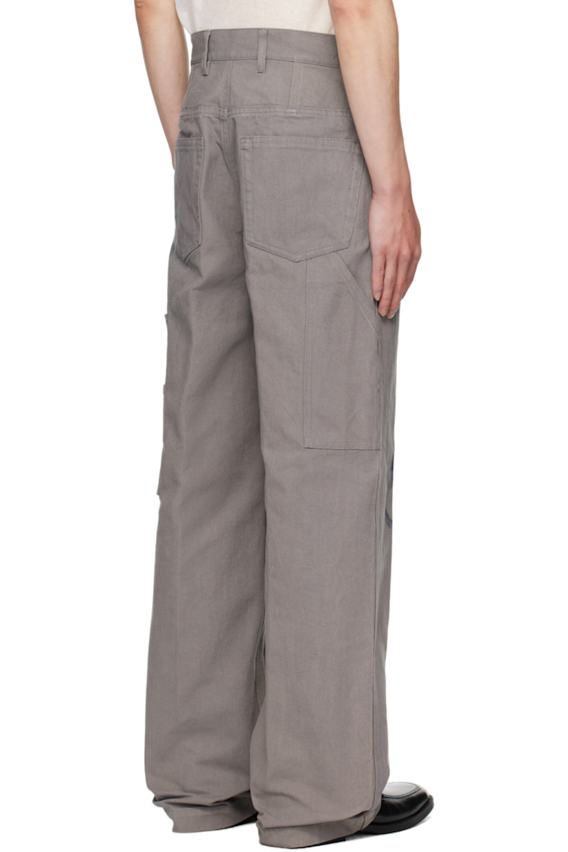 Cotton canvas trousers.

· Graphic printed throughout
· Belt loops
· Five-pocket styling
· Button fly
· Creased legs
· Patch pockets at back

Supplier color: Grey