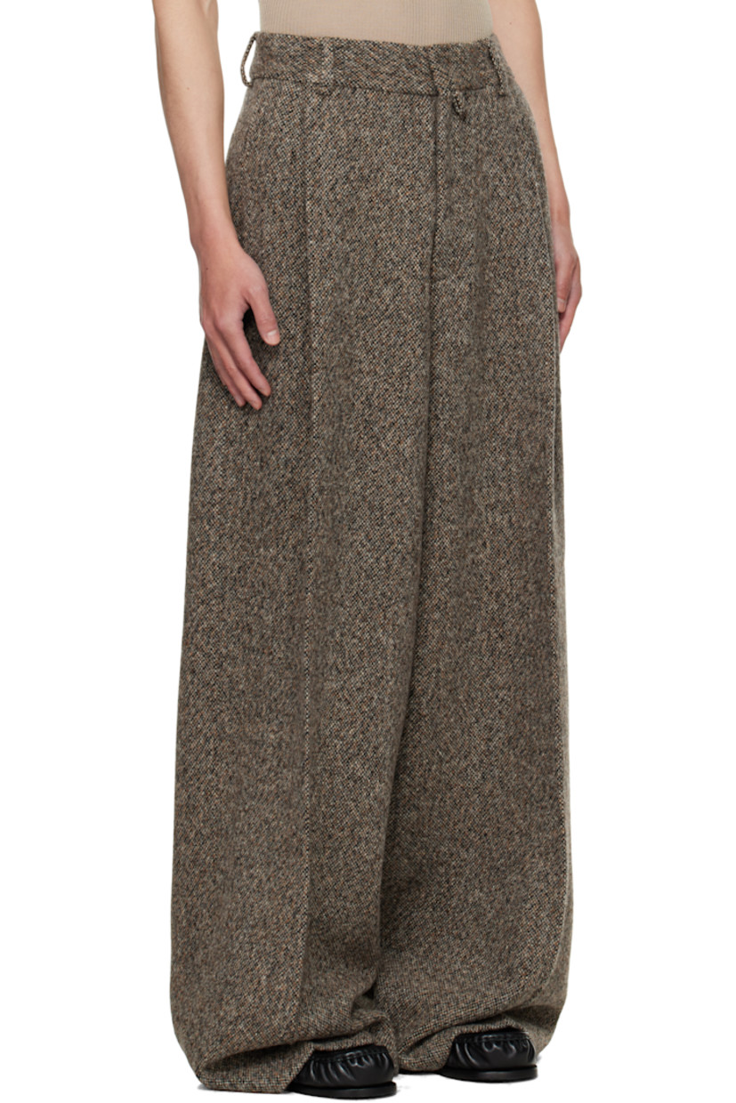 Wool-blend tweed trousers.

· Wide-leg 
· High-rise
· Belt loops 
· Four-pocket styling
· Zip fly
· Pleats at front
· Creased legs

Supplier color: Rust