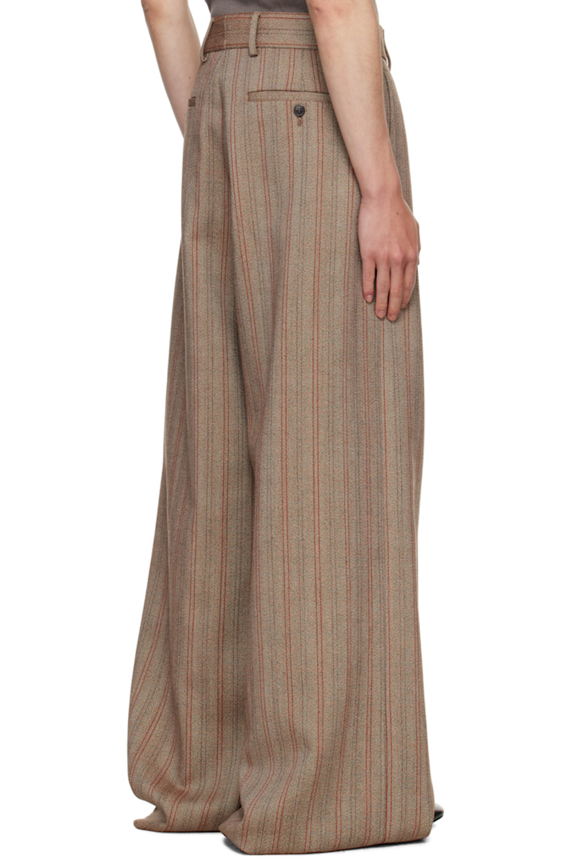 Wool canvas trousers.

· Stripes throughout
· Wide-leg 
· High-rise
· Belt loops
· Four-pocket styling
· Zip fly
· Pleats at front
· Creased legs

Supplier color: Rust