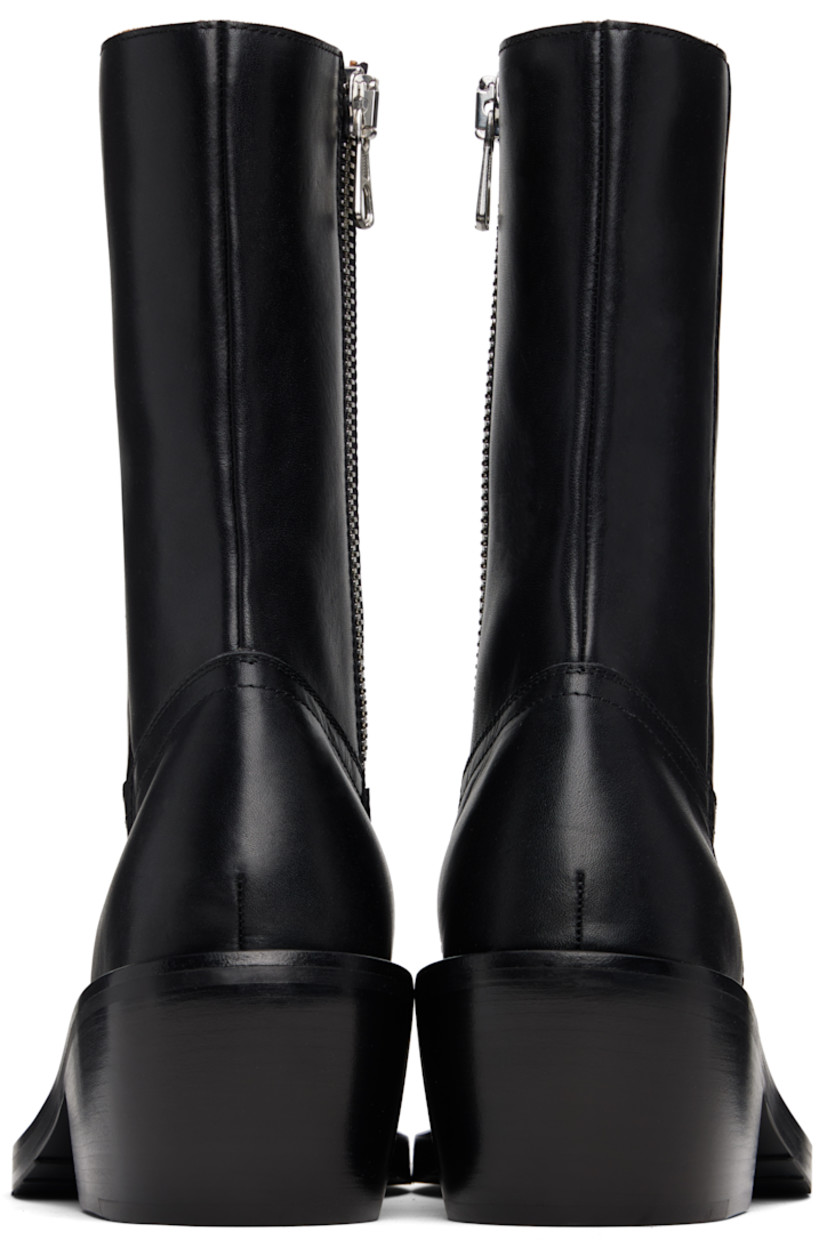 Mid-calf buffed leather boots.

· Square toe
· Zip closure at inner side
· Topstitching at welt
· Stacked leather heel with rubber injection
· Leather sole with Vibram® rubber injection
· Heel: H2.5"

Supplier color: Black