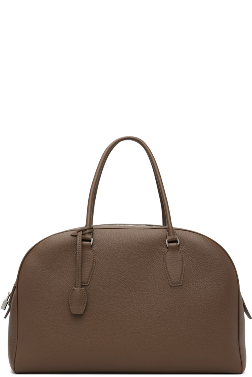 Grained calfskin top handle bag.

· Rolled carry handles
· Detachable sheathed key at handle
· Logo-engraved padlock at side
· Zip closure
· Zip and patch pocket at interior
· Buffed leather lining
· H10" x W15.5" x D5"

Supplier color: Dark olive