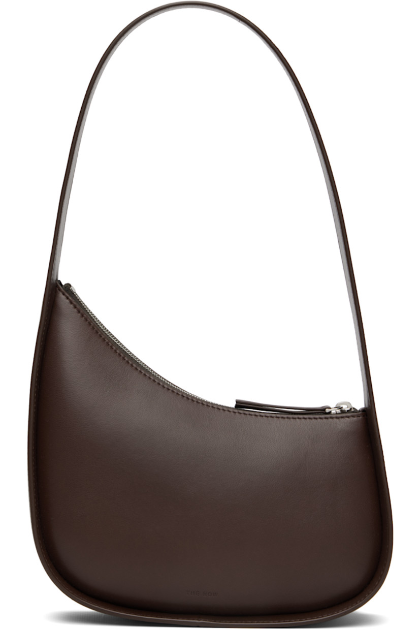 Buffed lambskin shoulder bag.

· Fixed shoulder strap
· Logo embossed at face
· Zip closure
· Buffed leather lining
· H7" x W8" x D2.5"

Supplier color: Brown melange