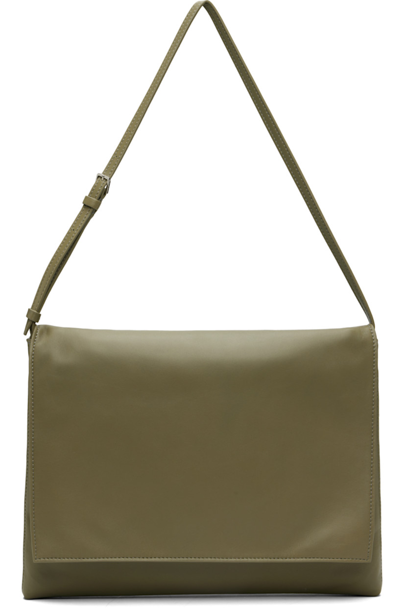 Buffed lambskin shoulder bag.

· Adjustable shoulder strap
· Logo embossed at back face
· Flap closure
· Detachable zip pouch at interior
· Buffed leather lining
· H10" x W12" x D1"

Supplier color: Sage