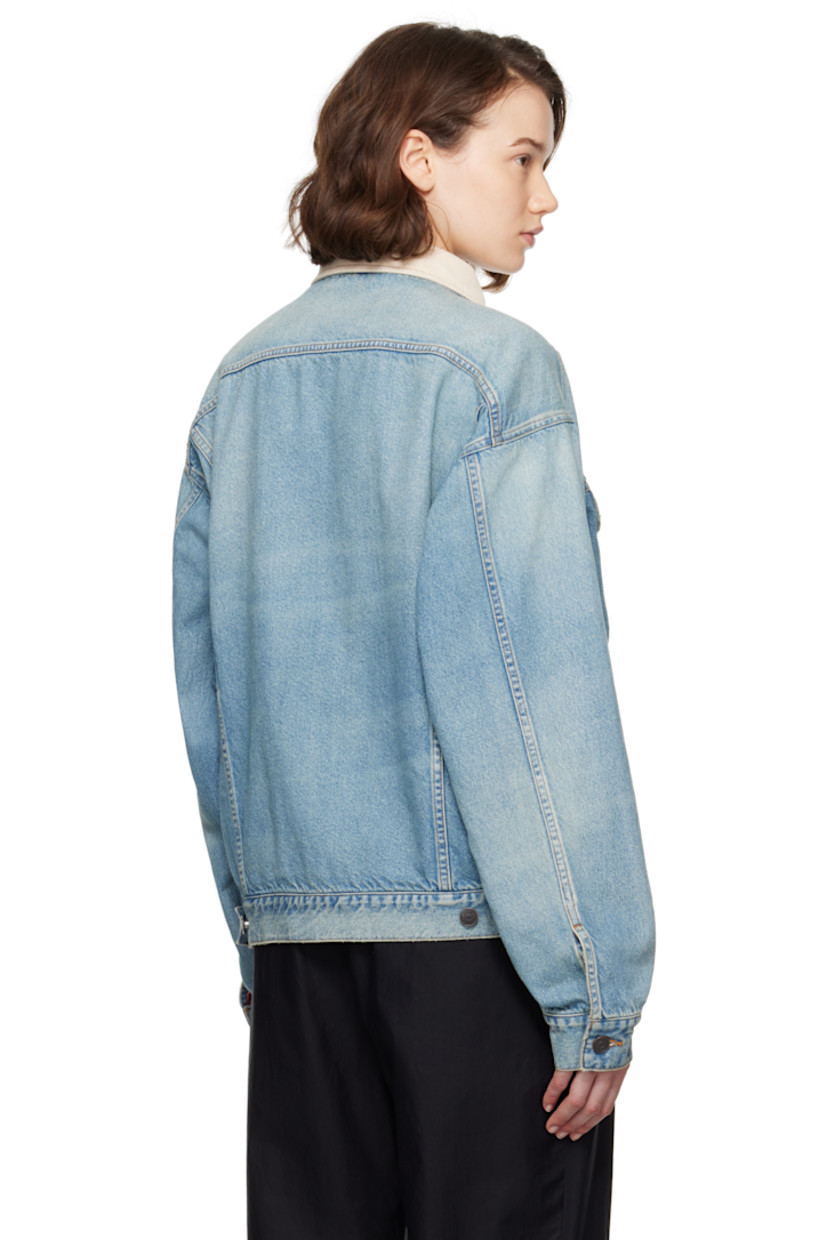 Non-stretch denim jacket. Fading throughout. 

· Corduroy spread collar
· Button closure
· Flap and welt pockets
· Pleats at front
· Buttoned barrel cuffs
· Adjustable button tabs at back hem
· Full flannel lining
· Logo-engraved antiqued copper-tone hardware
· Contrast stitching in tan

Supplier color: Light indigo