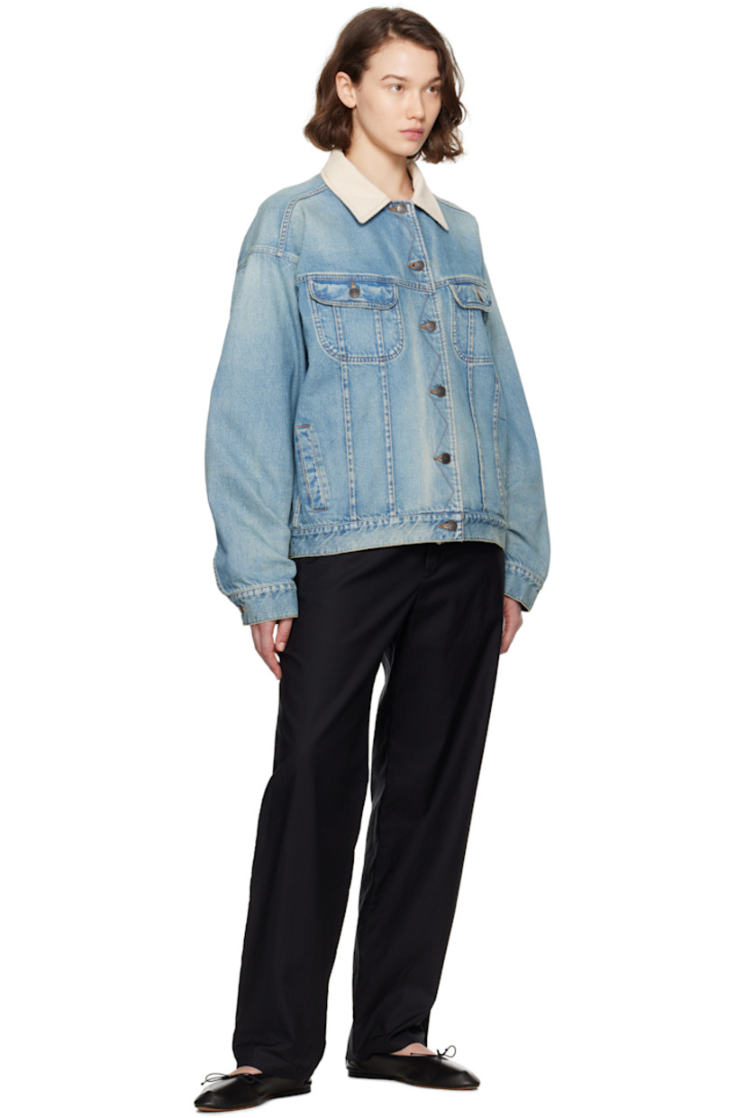 Non-stretch denim jacket. Fading throughout. 

· Corduroy spread collar
· Button closure
· Flap and welt pockets
· Pleats at front
· Buttoned barrel cuffs
· Adjustable button tabs at back hem
· Full flannel lining
· Logo-engraved antiqued copper-tone hardware
· Contrast stitching in tan

Supplier color: Light indigo