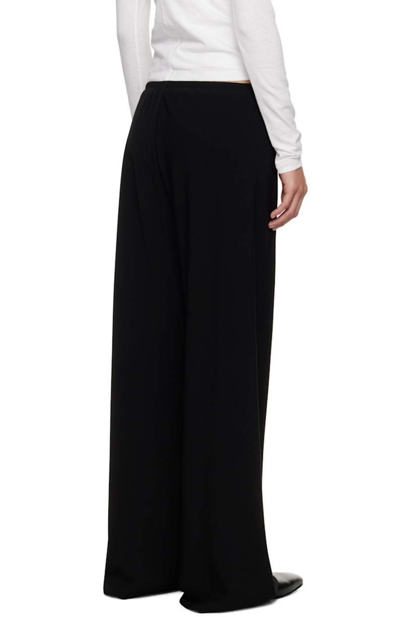Double-faced cady trousers.

· Bias-cut 
· Wide-leg
· Elasticized waistband

Supplier color: Black