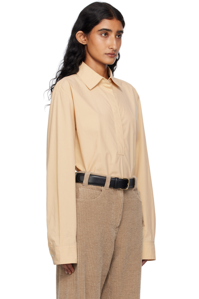 Lightweight sanded cotton poplin shirt. 

· Spread collar
· Concealed five-button placket 
· Shirttail hem 
· Buttoned barrel cuffs
· Mother-of-pearl hardware 

Supplier color: Sand