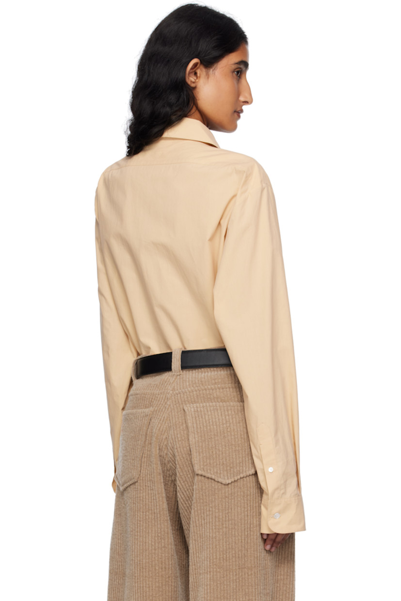 Lightweight sanded cotton poplin shirt. 

· Spread collar
· Concealed five-button placket 
· Shirttail hem 
· Buttoned barrel cuffs
· Mother-of-pearl hardware 

Supplier color: Sand